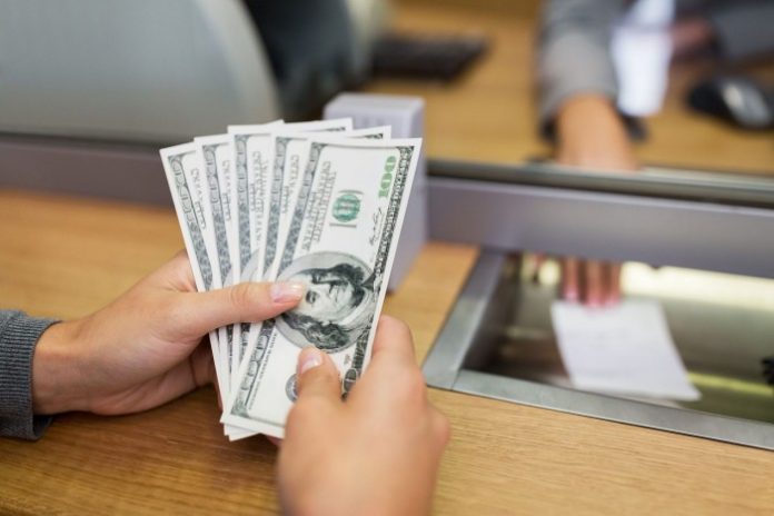 hands-with-money-at-bank-office-or-exchanger-PXSCB2B-min